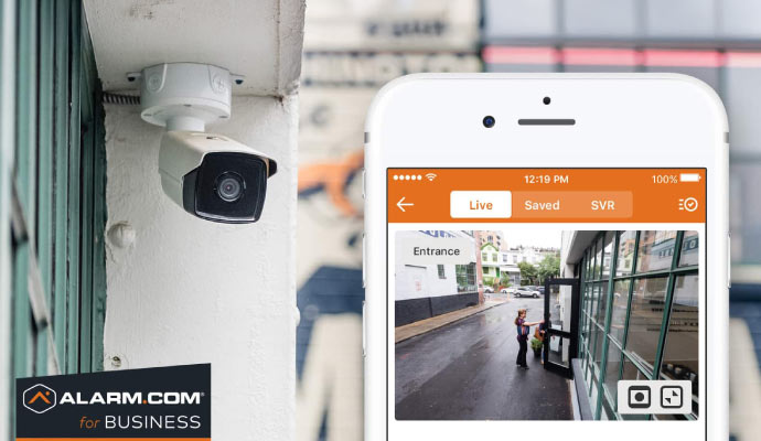 Outdoor camera with mobile feed Installed outdoor security camera showing live footage on a mobile device
