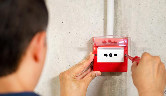 Person installing fire alarm system