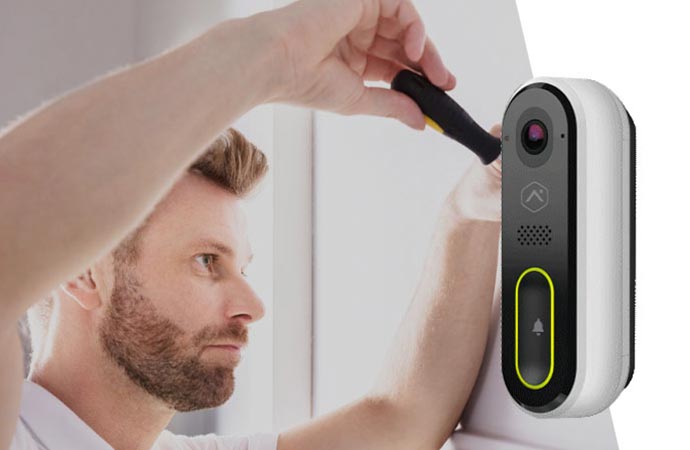 professional worker installing smart doorbell