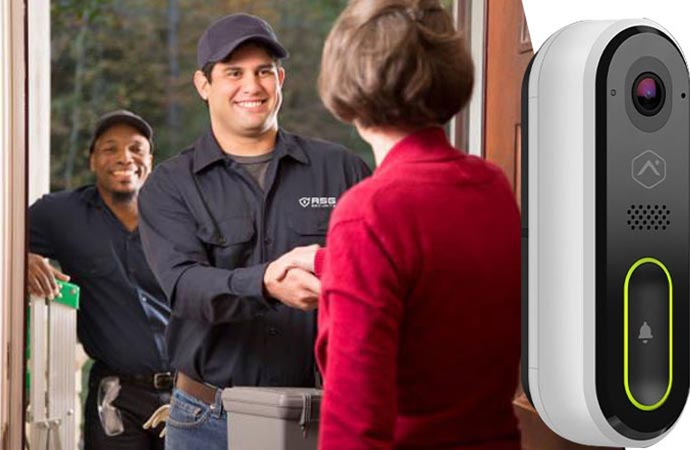 Technician handshaking at doorstep after installing video doorbell