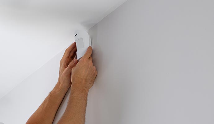 Motion sensor installation on wall.