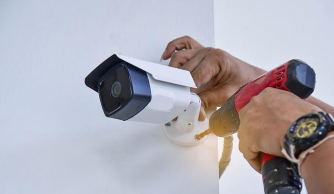 a professional installing a camera