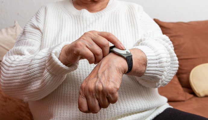 An elderly person using medical alert system